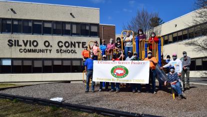 Team from Pittsfield UNICO cleaned up around Silvio O. Conte Community School.